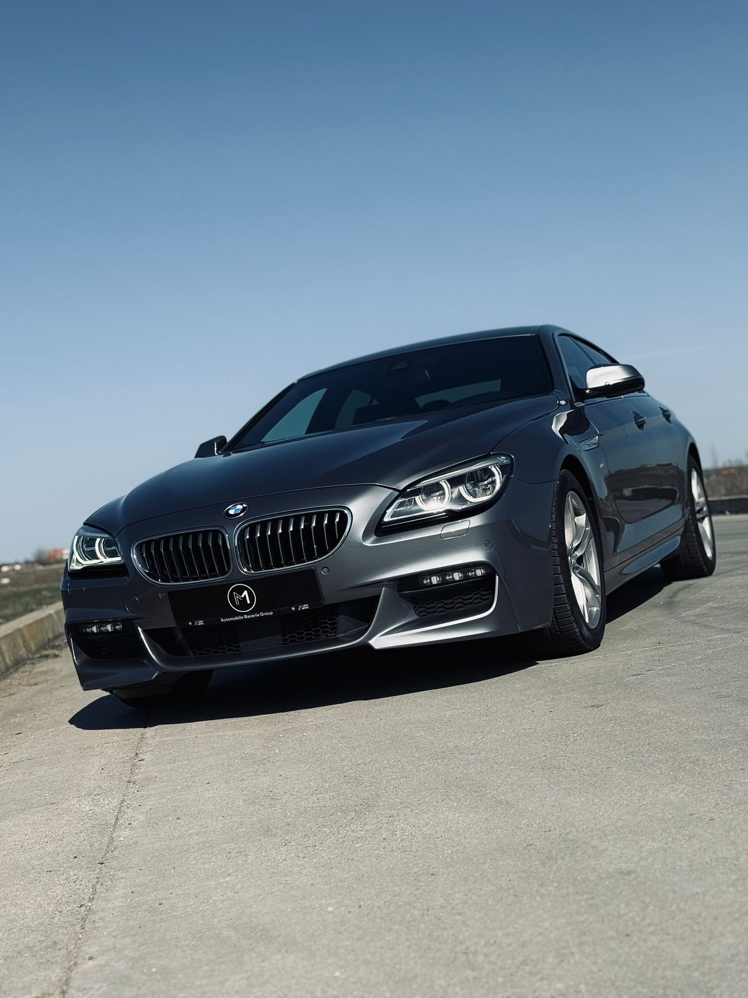 BMW Seria 6 Gran Coupé gri, față trei sferturi, cadraj strâns