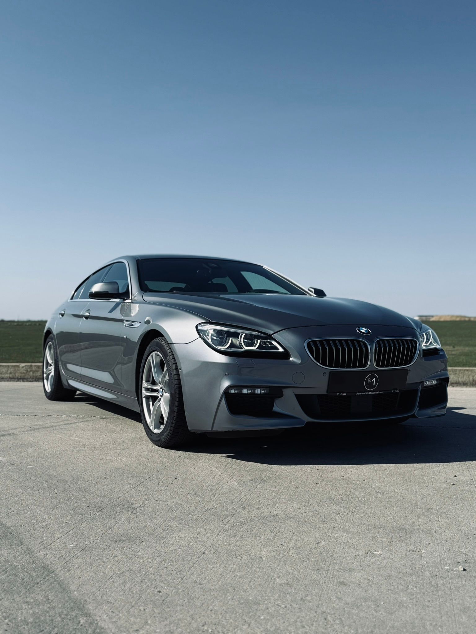 BMW Seria 6 Gran Coupé gri, vedere față trei sferturi, pachet M Sport