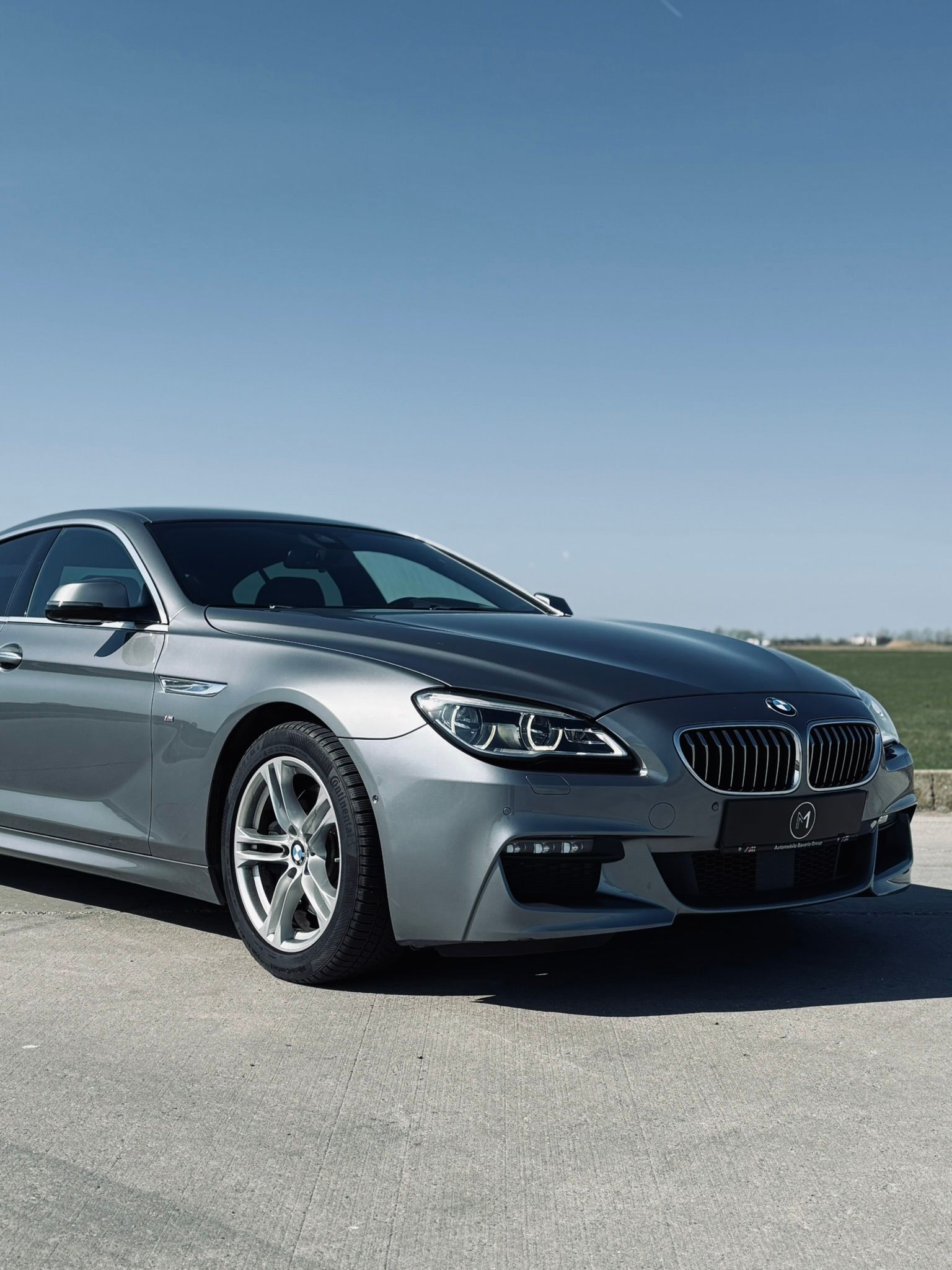BMW Seria 6 Gran Coupé gri, față trei sferturi